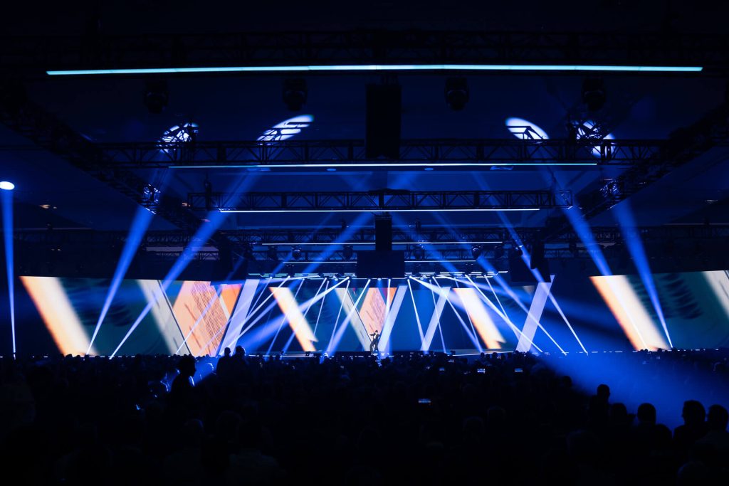 Stage with bright lights and visuals at hp event